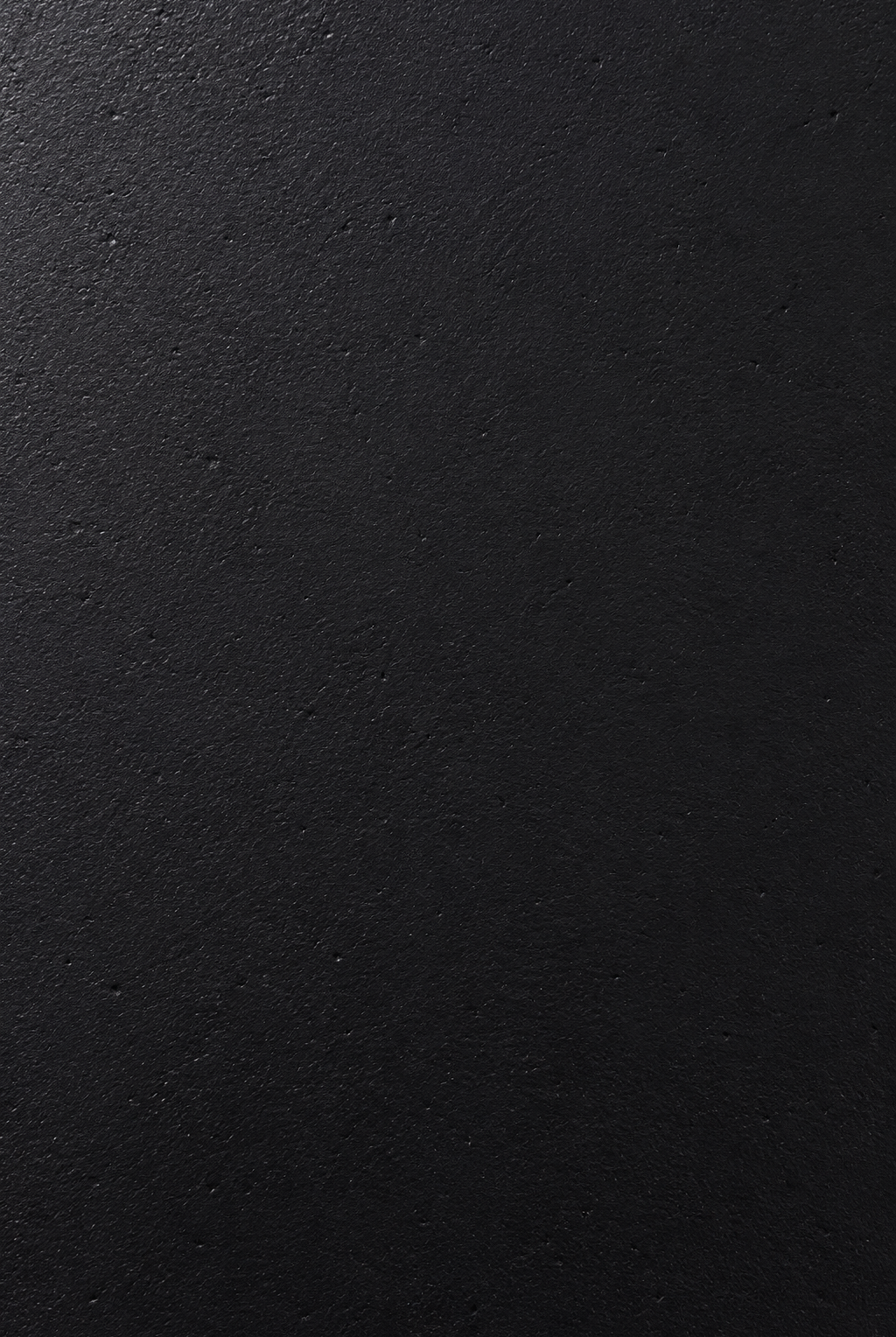 Fiorenne black microconcrete round dining table closeup view