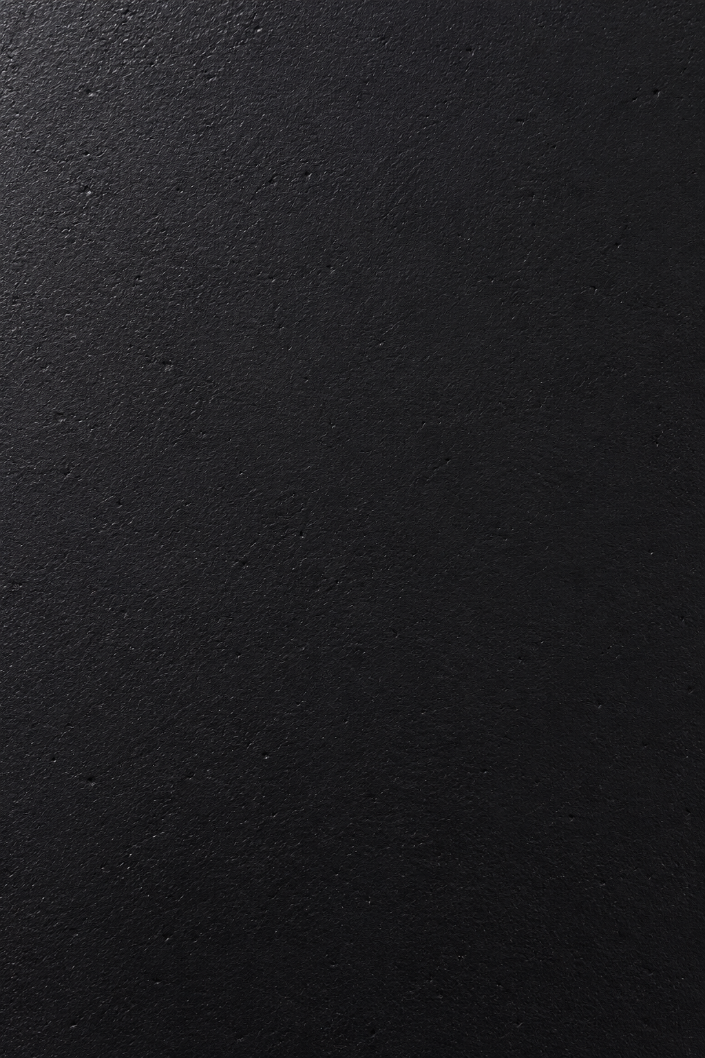 Tazira black microconcrete tabletop material closeup