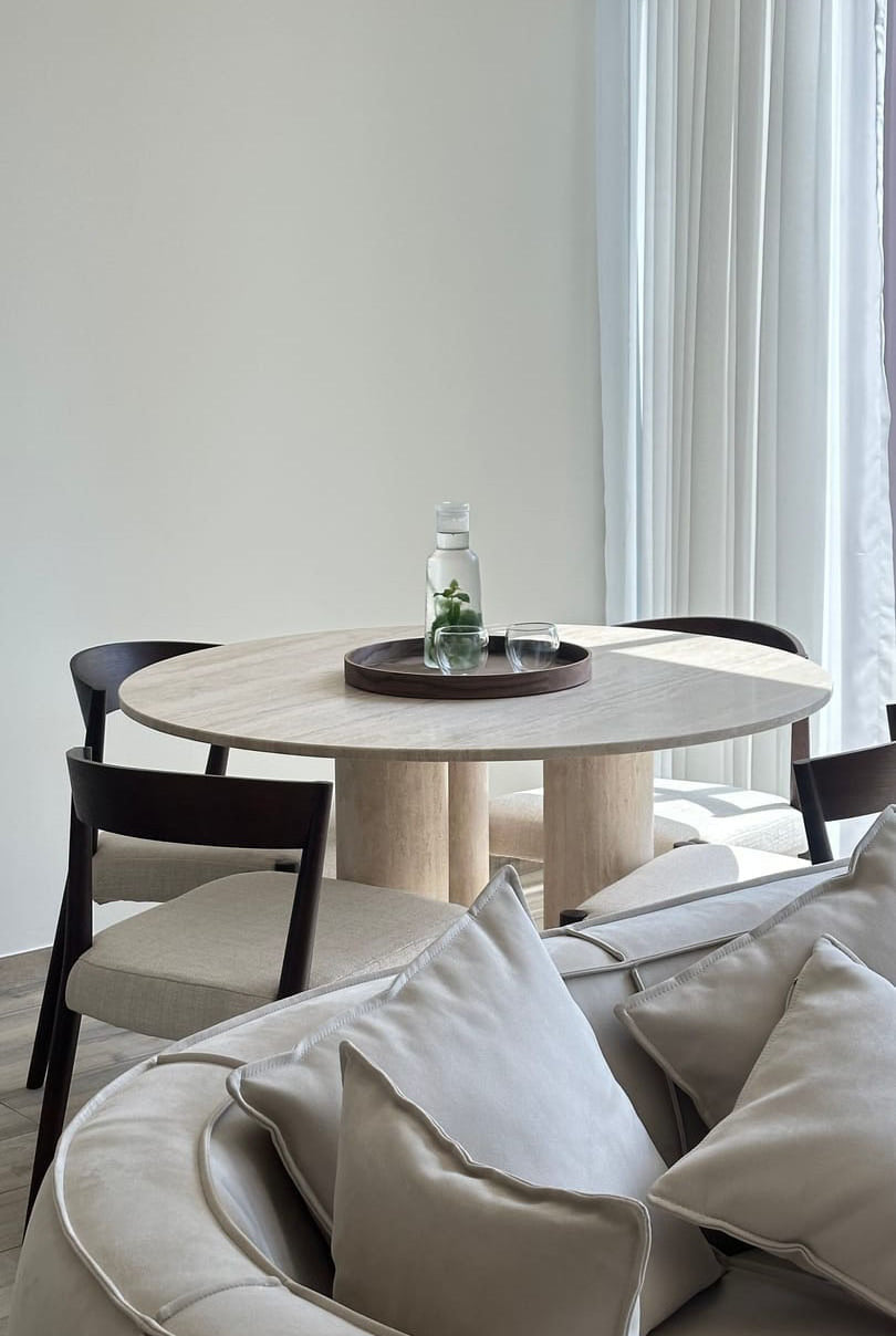 Thalassa Round Beige Travertine Dining Table with Three Legs