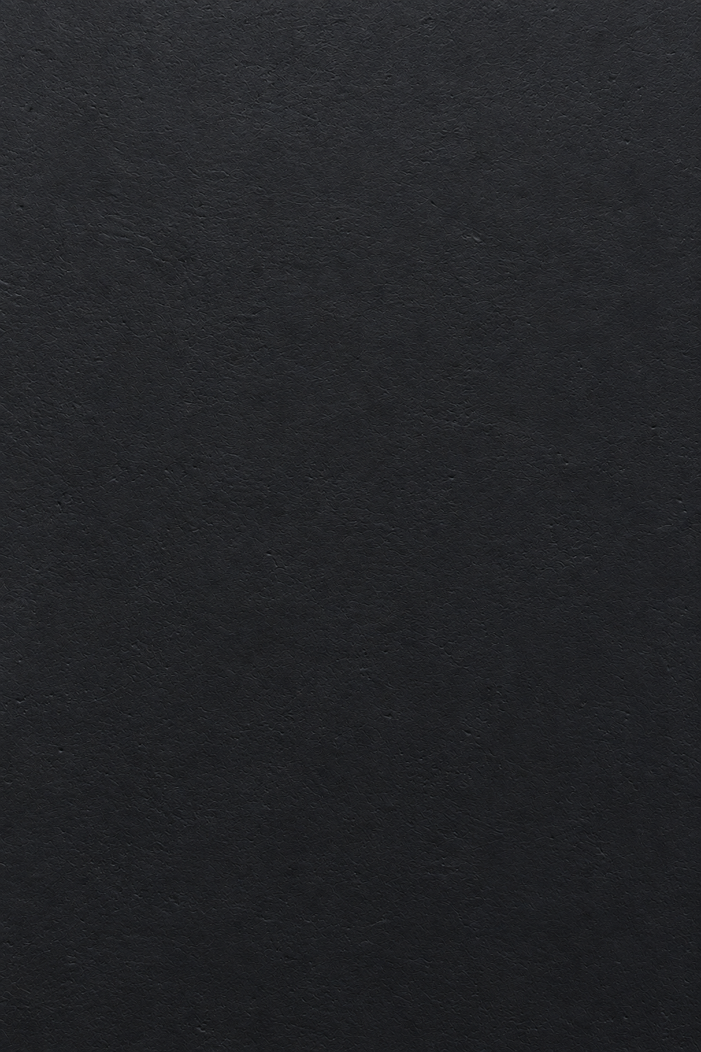 Black microconcrete tabletop material closeup