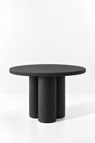 Olessa Black Microconcrete Round Dining Table with three cylindrical supports