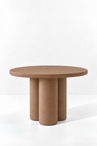 Olessa Brown Microconcrete Round Dining Table with three cylindrical supports