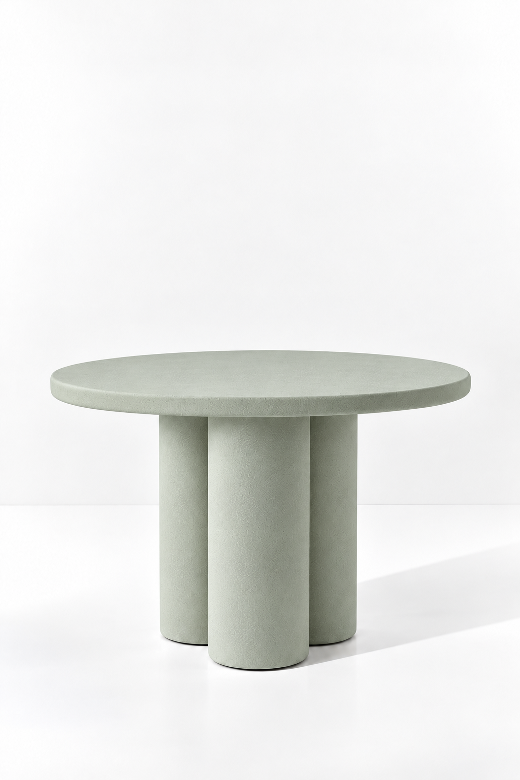 Olessa Pistachio Green Microconcrete Round Dining Table with three cylindrical supports